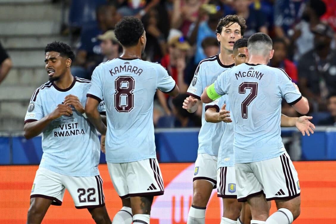 Aston Villa players celebrate scoring a goal